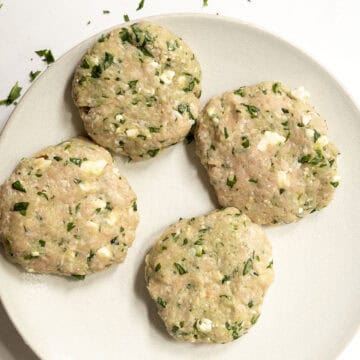 4 chicken patties on a plate.