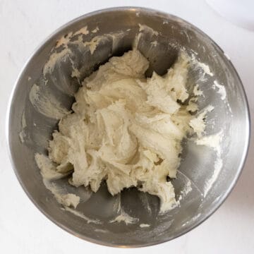 Combining all cookie ingredients in a standing mixer.