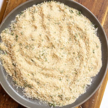 Seasoned breadcrumbs on a plate.
