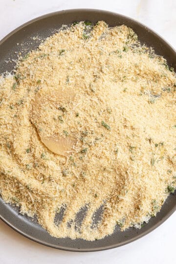 Chicken breast dredged in breadcrumbs.