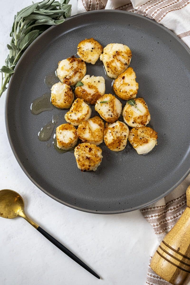 garlic sage seared scallops on a plate