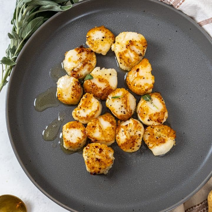garlic sage seared scallops on a plate