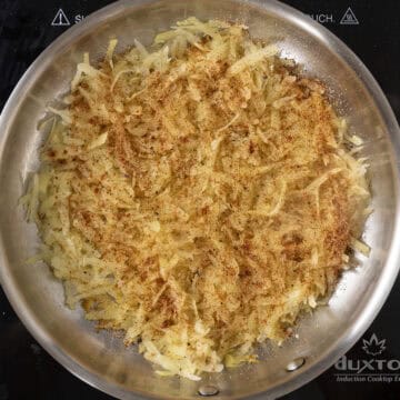 Layer of hash browns, seasoned with paprika, garlic powder, and salt.
