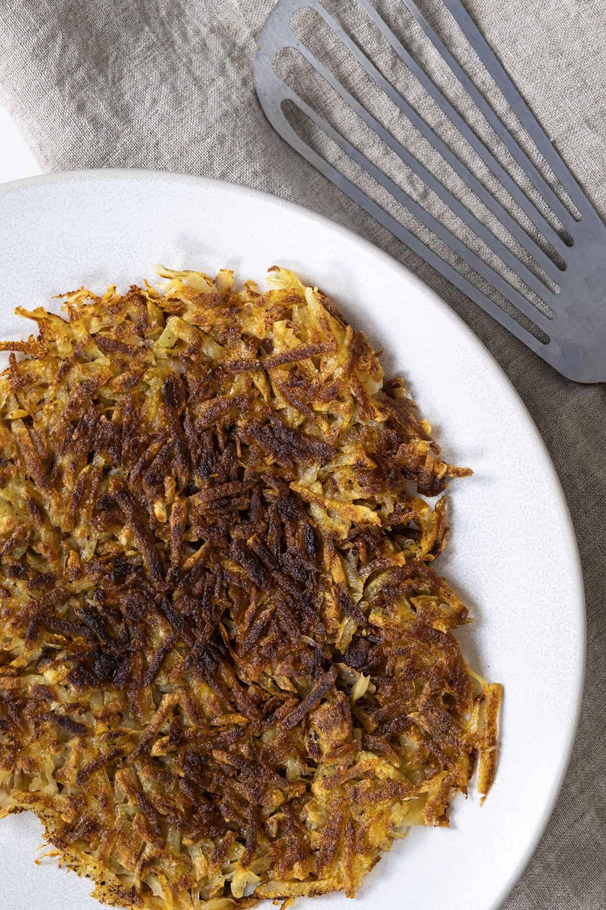 Crispy fried hash browns. on a plate.