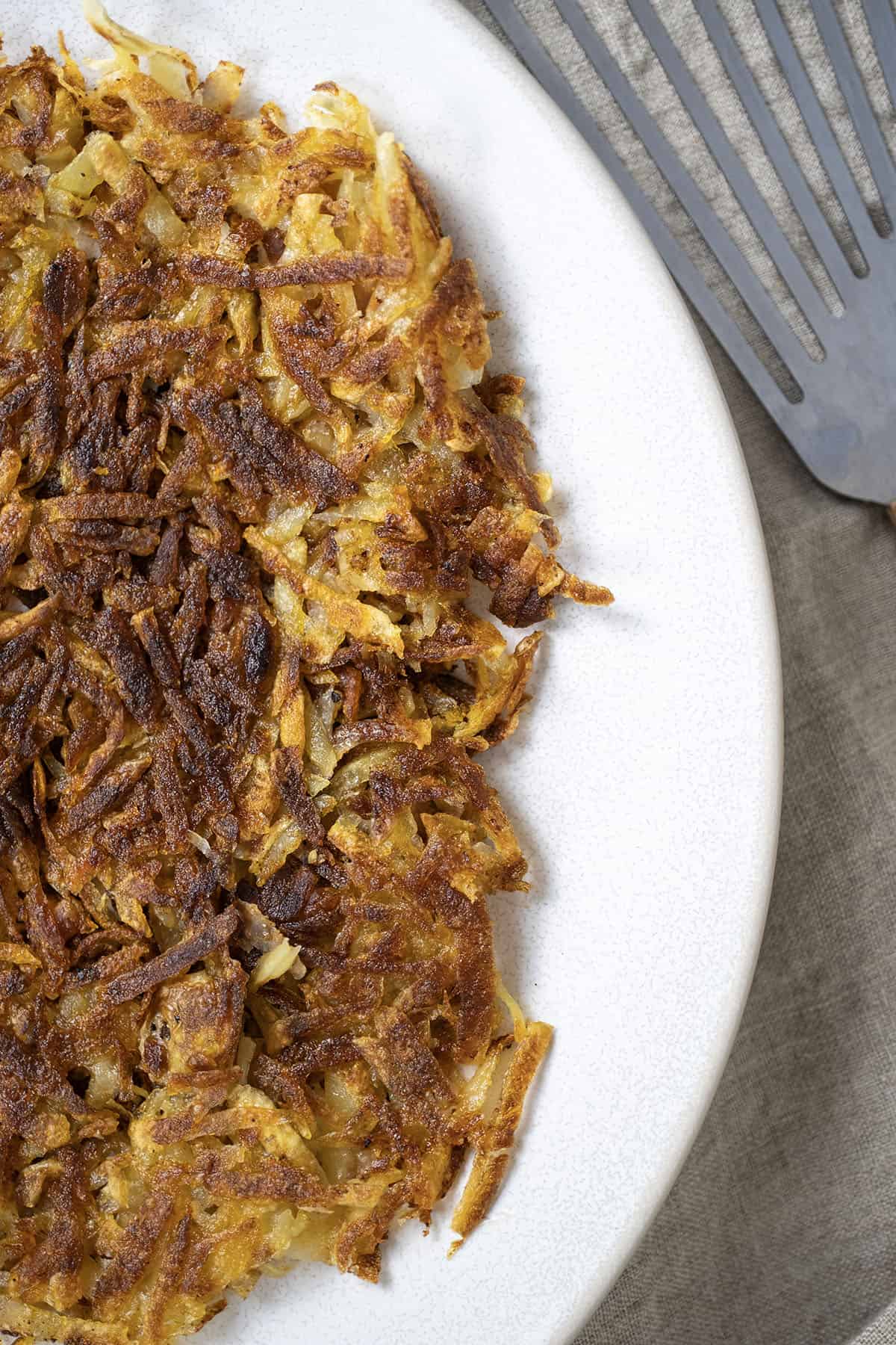 Crispy fried hashbrowns. on a plate.