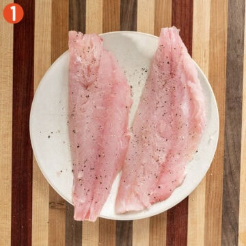 Snapper seasoned with salt and pepper.