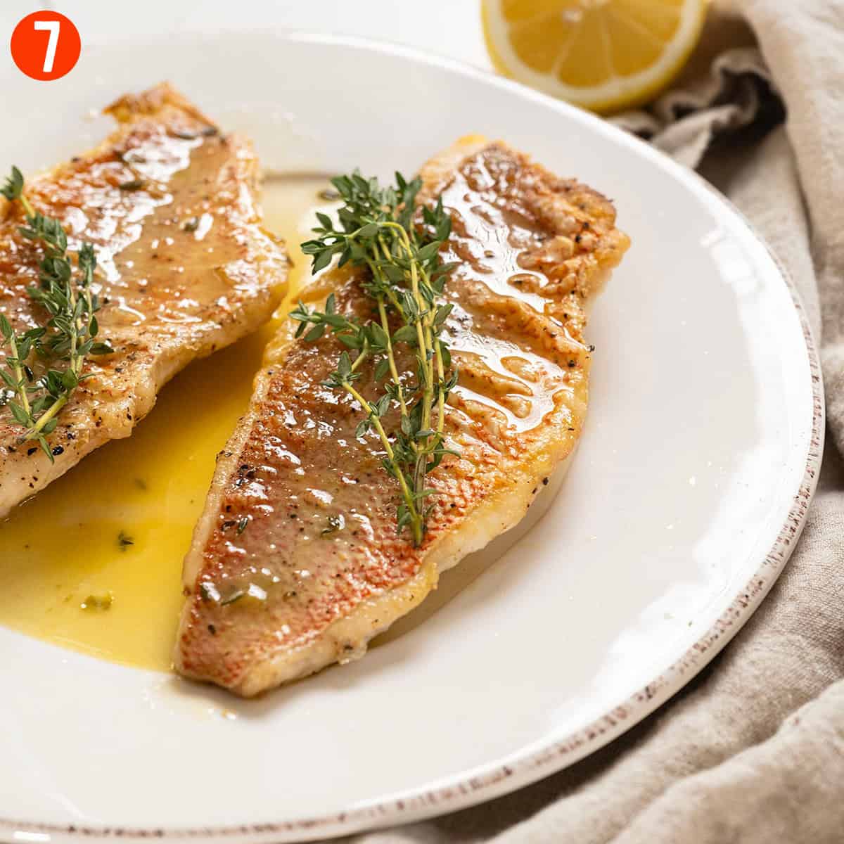 Sauce poured over snapper.