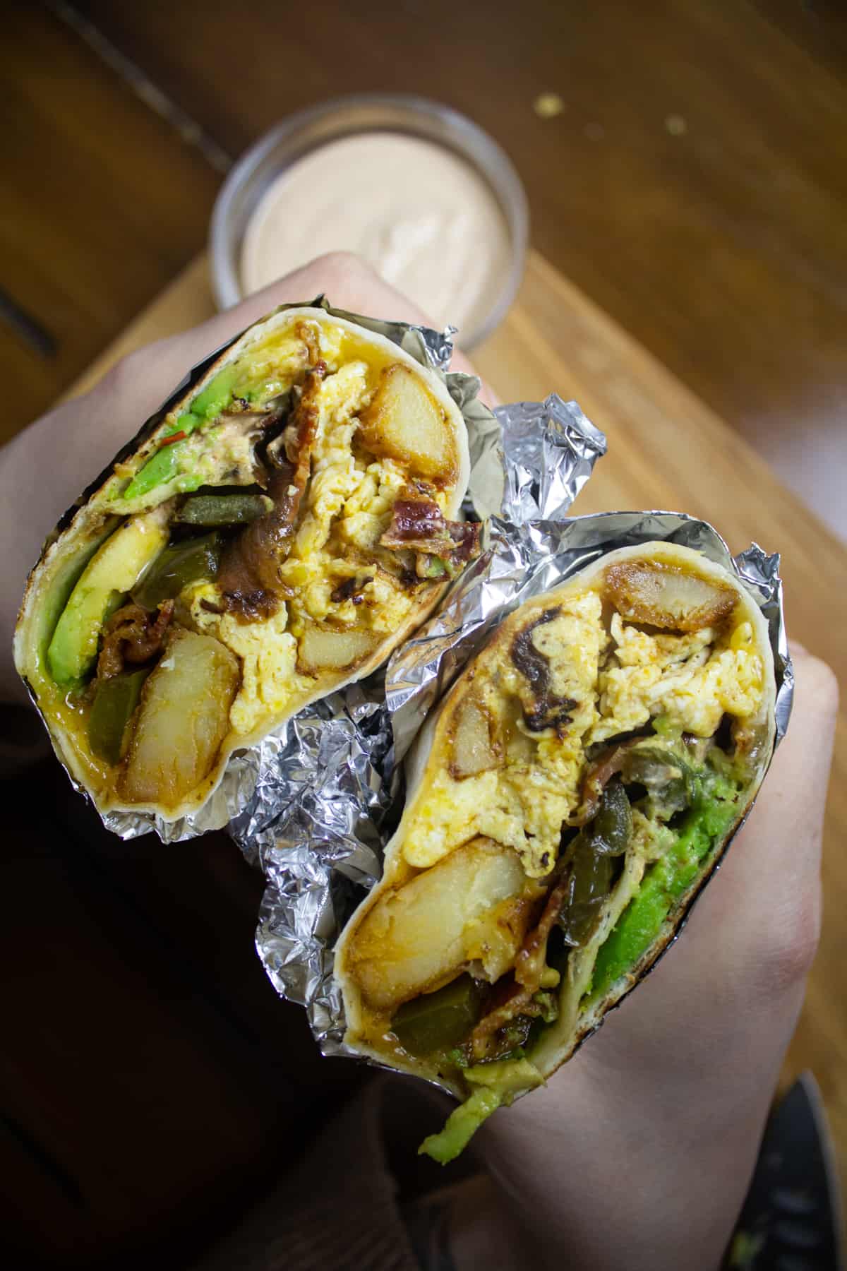 Peppers, potatoes, bacon, egg, and cheese burrito