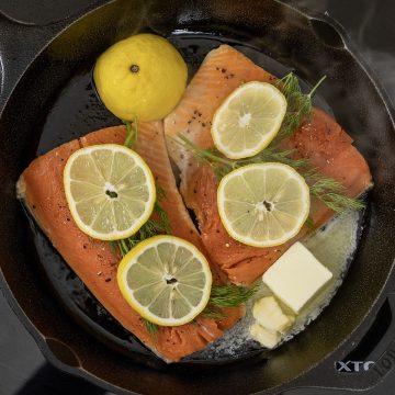 basting lemon dill salmon in the cast iron
