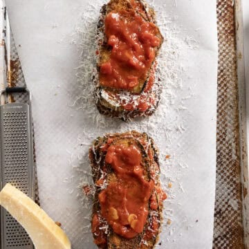 Eggplant piled into layers of eggplant, marinara, and parmesan.