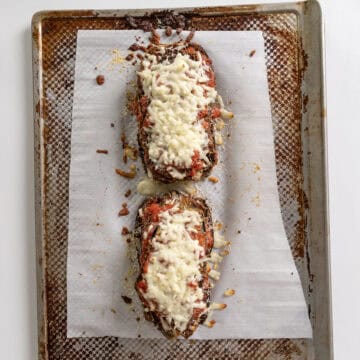 Eggplant layers topped with mozzarella and parmesan, toasted in the oven.