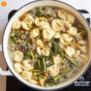 Boiling tortellini in soup.