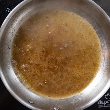 Pasta water added to the guanciale fat in the sauce pan.