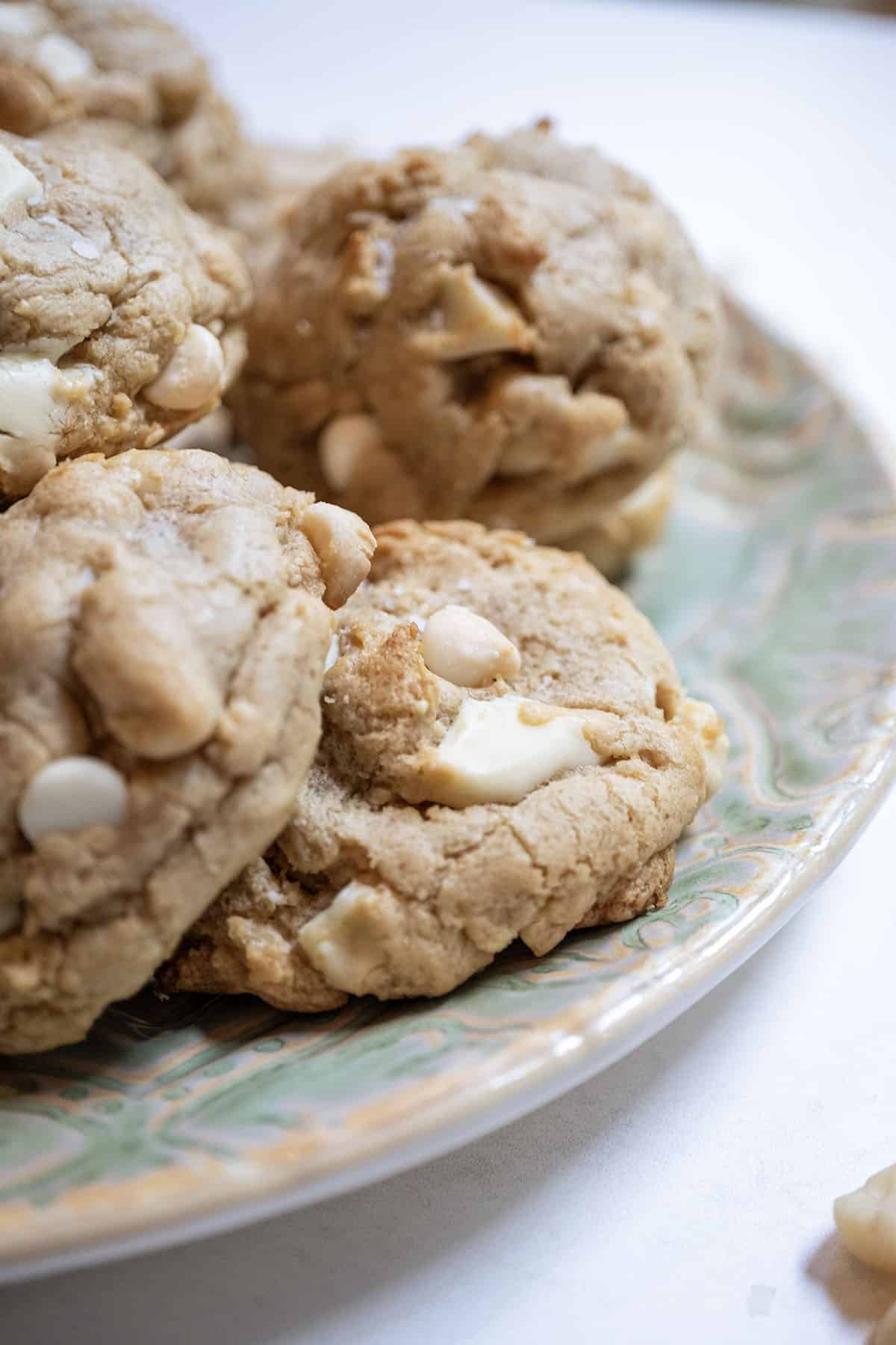 White chocolate macadamia nut cookies on a plate.