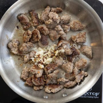 Seared ground sausage with garlic and crushed red pepper.