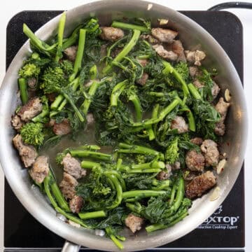 Chopped broccoli rabe added to the sauce.