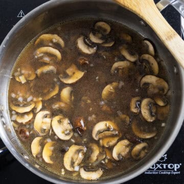 Marsala wine and chicken broth added to the pan with mushrooms and shallots.