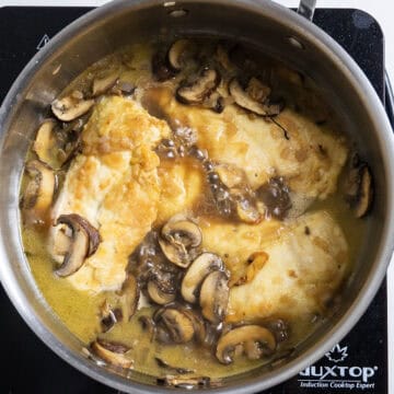 Chicken added to the sauce to simmer and finish cooking.