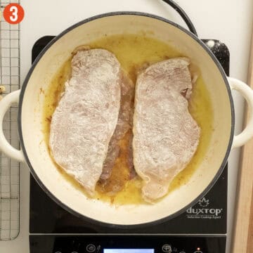 Frying chicken with prosciutto, prosciutto side down.
