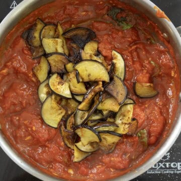 Fried eggplant added to the sauce.