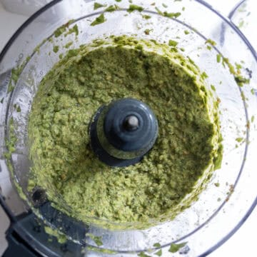 Lemon and olive oil added to food processor and processed to smooth.