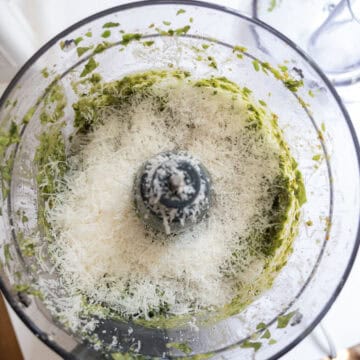 Parmesan added to pesto.