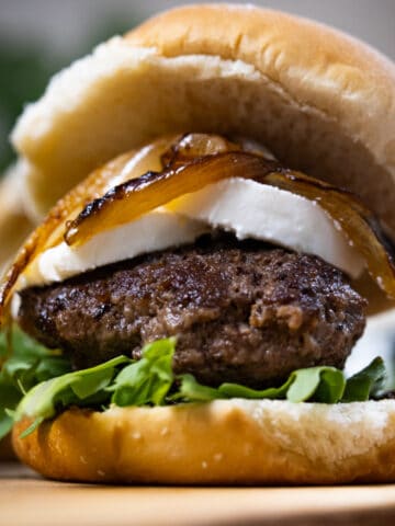 goat cheese and fig jam slider on a cutting board