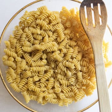 pasta combined with olive oil in a bowl.