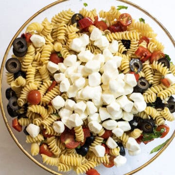 mozzarella balls on top of the pasta salad.