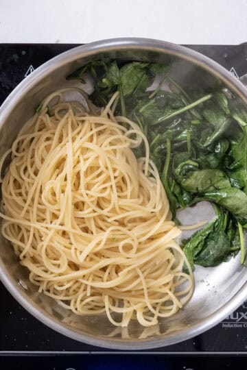 Pasta added to spinach.