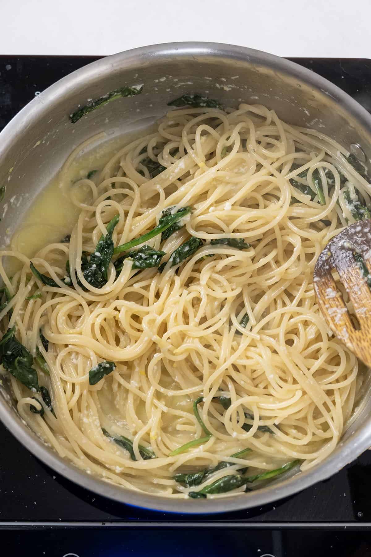 Pecorino and lemon mixture added to pasta.