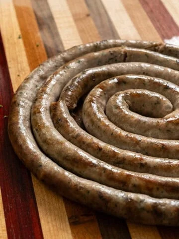 Italian ring sausage on a cutting board.