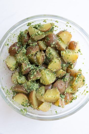 pesto completely combined with red potatoes