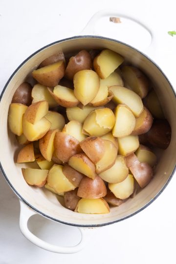 potatoes transferred back to hot pot after being boiled