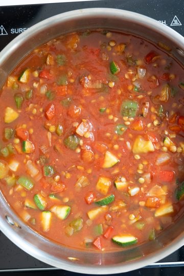 crushed tomatoes and water added to pan