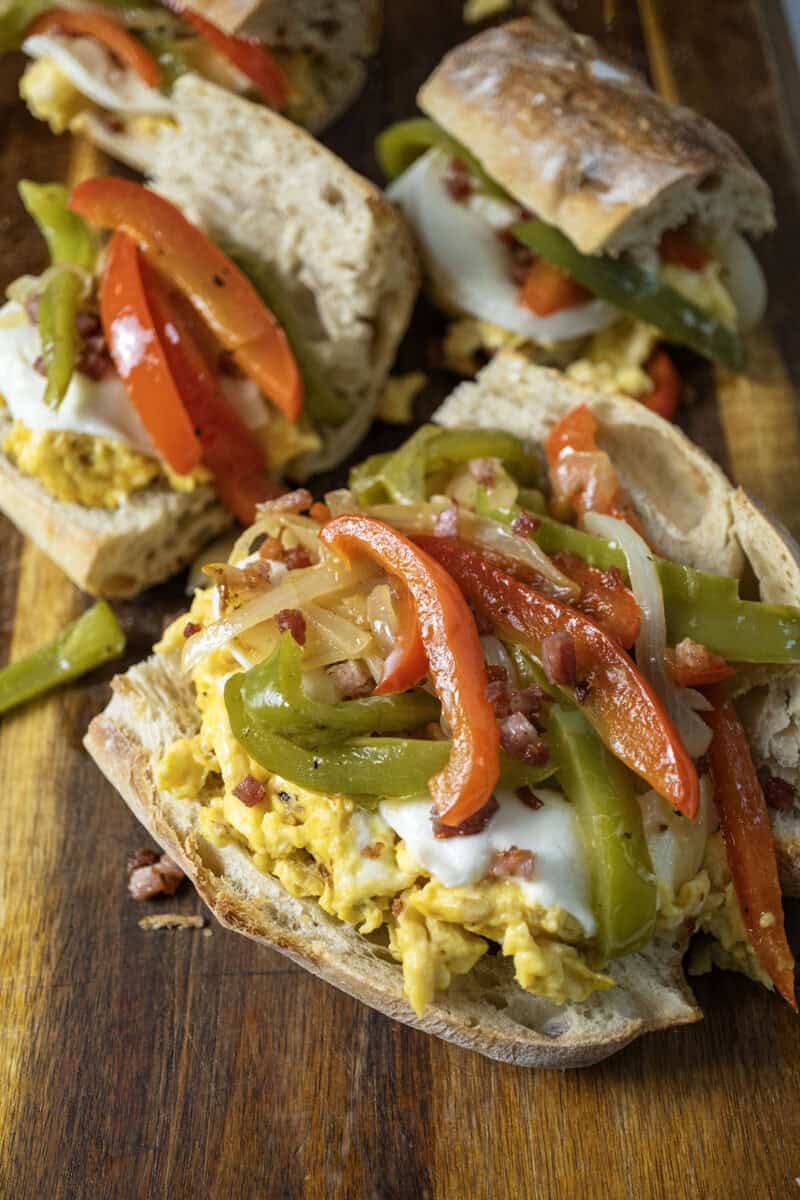 Peppers and eggs sandwich with mozzarella and pancetta on Italian Bread.