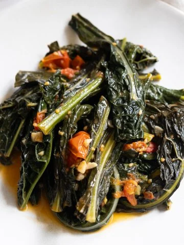 finished lacinato kale recipe braised with cherry tomatoes and garlic