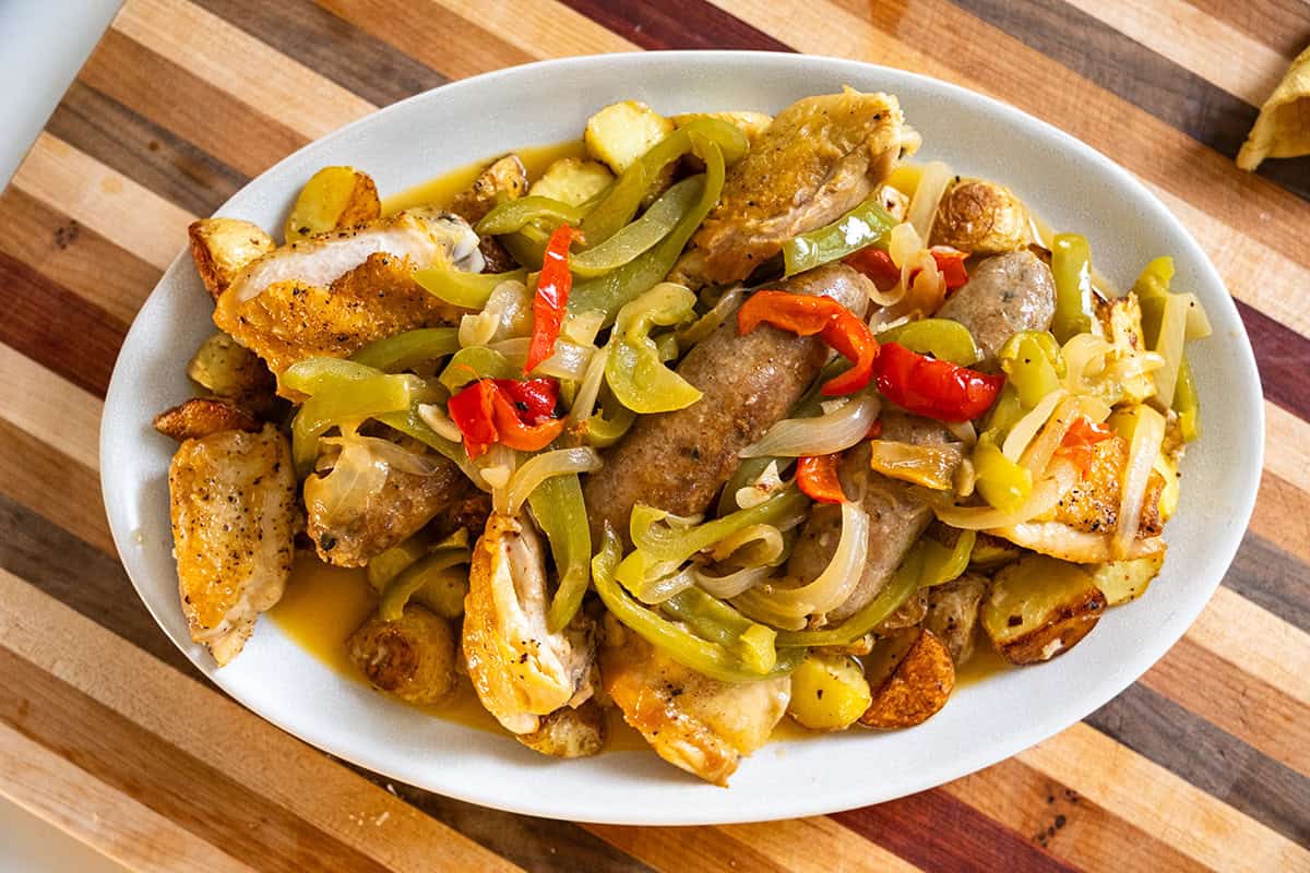 Chicken scarpariello served over crispy potatoes.