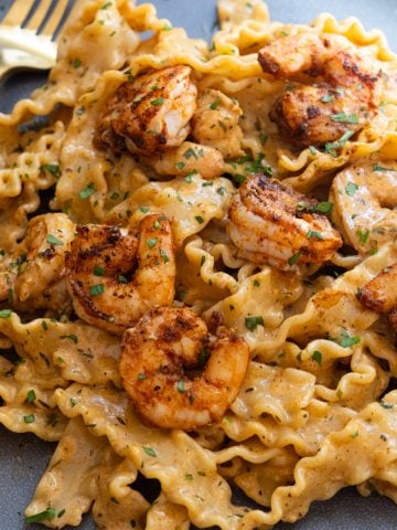 cajun shrimp scampi topped with parsley and parmesan