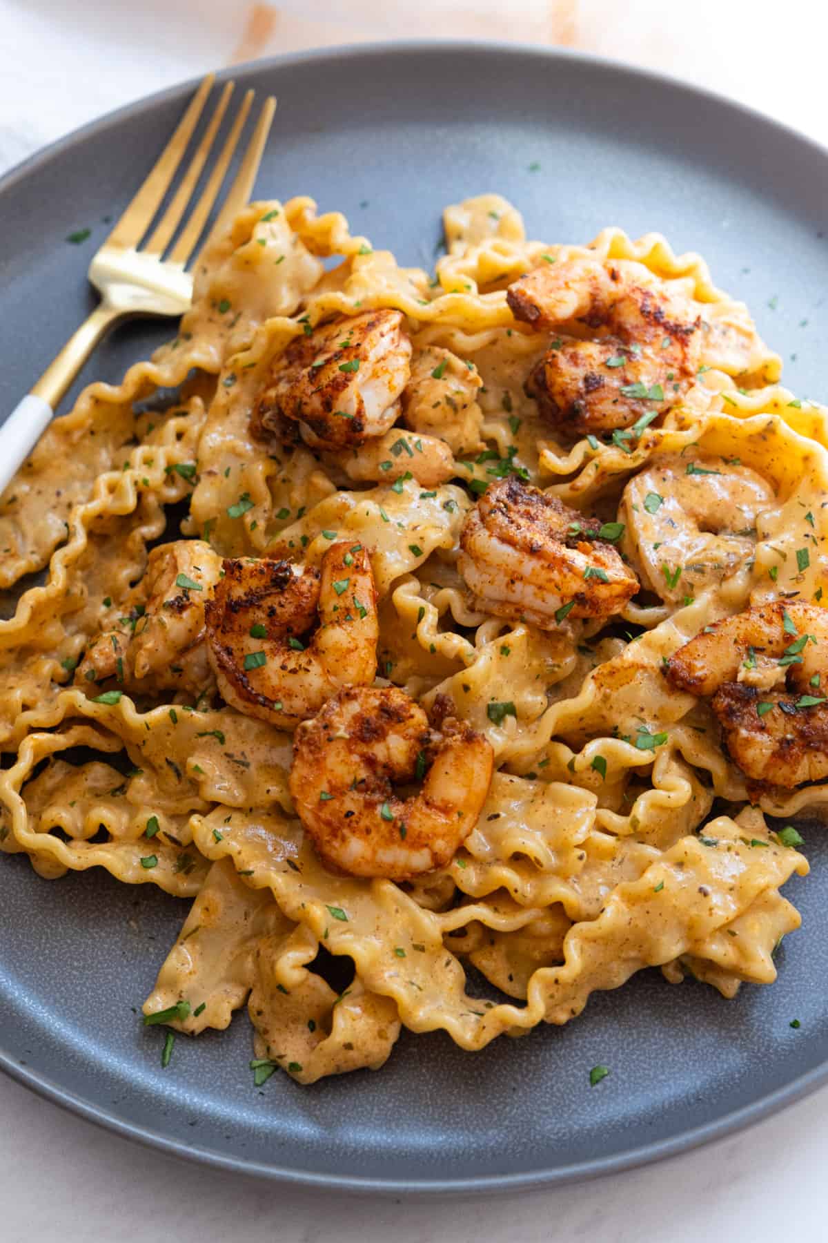 Cajun Shrimp Scampi topped with parsley and parmesan