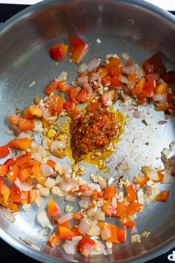 calabrian chili peppers added to garlic, shallots, and red peppers