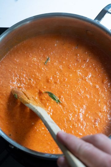 creamy red pepper sauce in a saucepan
