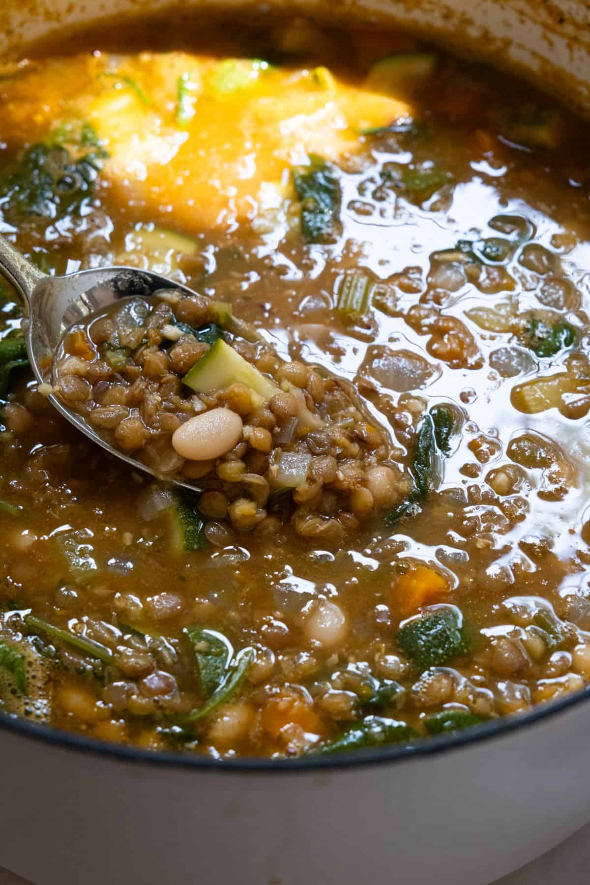 Finished white bean and lentil soup in a pot.