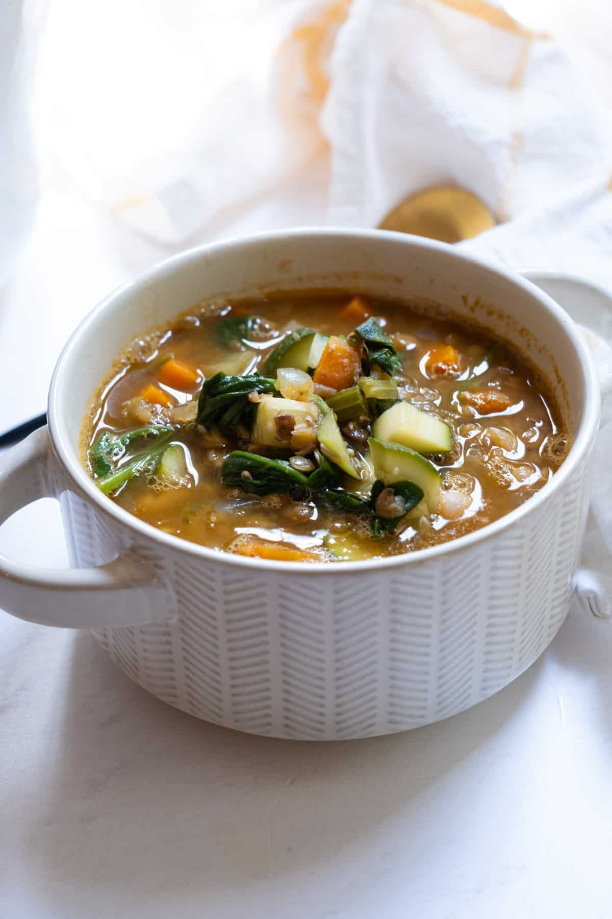 White bean and lentil soup in a bowl.