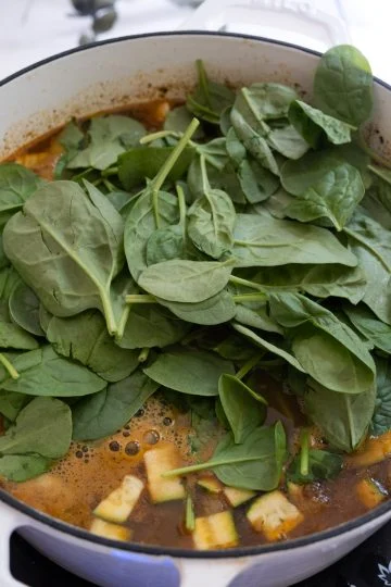 Spinach added to the soup.