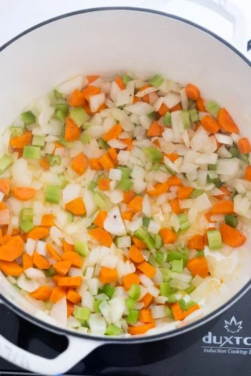 sauteing the carrots, celery, and onion.