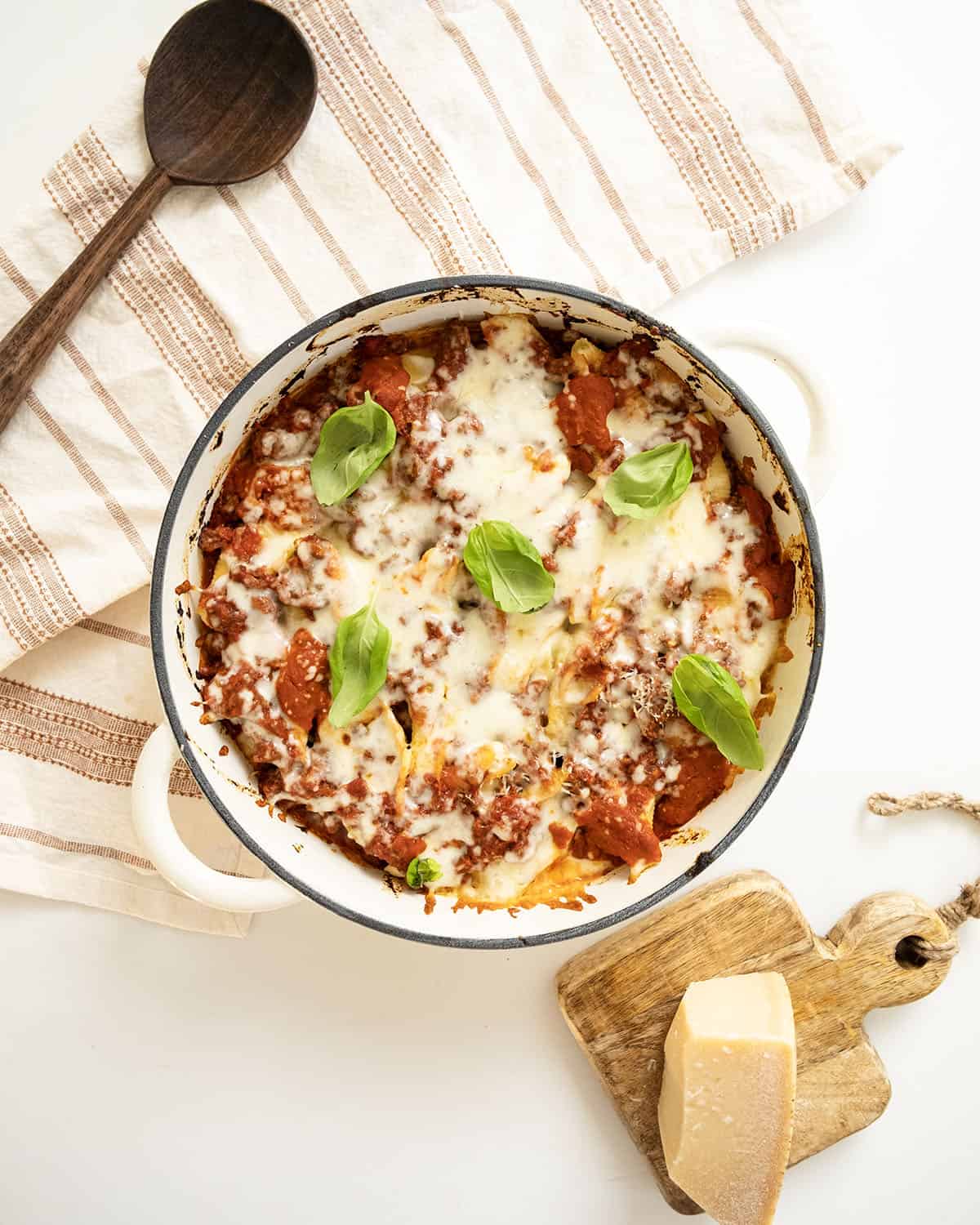 Italian stuffed shells with melted mozzarella in a dish.