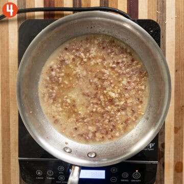 Simmering pancetta and a garlic with pasta water.
