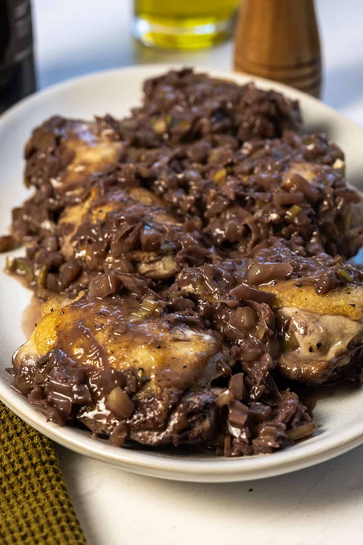 Chicken thighs covered in red wine and fennel sauce