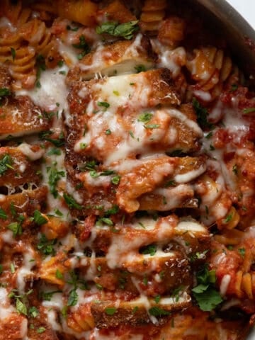 creamy chicken parmesan pasta in a skillet